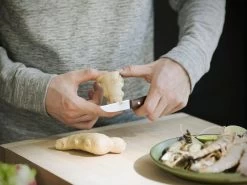 Fiskars Norr Peeling Knife -Kitchencia Shop Fiskars Kitchen Action Norr Peeling knife cutting ginger 1016475