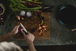 Fiskars Norden Paring Knife -Kitchencia Shop Fiskars Norden Paring knife cutting onion Hero image 1026424